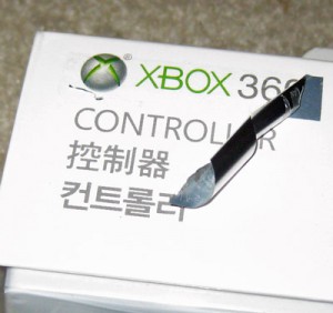 Counterfeit Xbox 360 controller -- peeling sticker